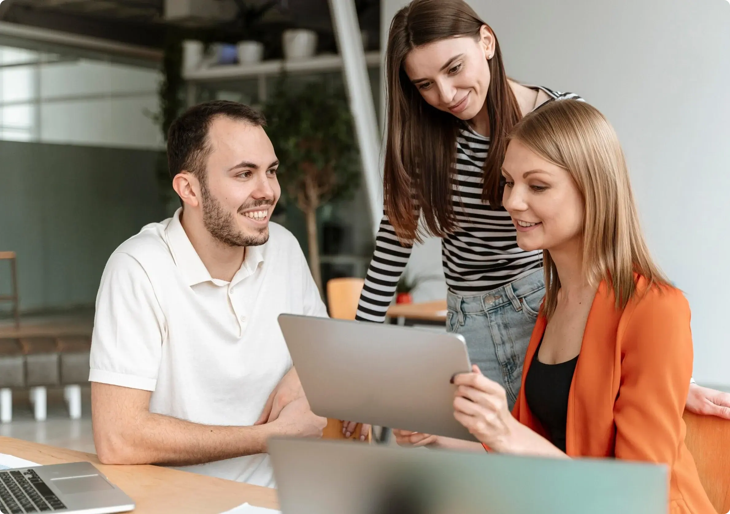 Product managers reviewing a roadmap and research findings with a client team